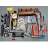 A collection of gun parts, accessories and tools including over and under pistol barrels, air