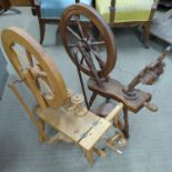 Two spinning wheels, one mahogany the other beech, tallest 90cm