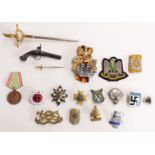 Replica Nazi German badges including enamel examples, novelty Toledo letter opener sword etc