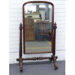 Victorian mahogany cheval mirror with turned stepped and graduated supports and stretcher and