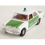 Corgi Toys diecast model Mercedes-Benz 240D police car with white and green body and tan interior,