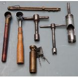 Seven shooting/ reloading tools comprising a brass spring loaded percussion cap dispenser, two