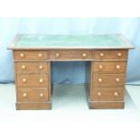 A 19th/20thC mahogany leather inset twin pedestal desk, W132 x D60 x H77cm