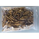 One-hundred-and-fifty 7.62 primed brass rifle cartridge cases.