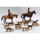 Wooden carved huntsmen on horseback and hound, in Berkeley Hunt livery