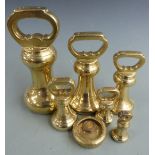 Run of six brass bell weights from 14lb down to 8oz, one marked Parsons Lewes, another Herbert &