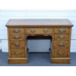 A 19th/20thC pollard oak or burrwood twin pedestal desk with graduated drawers, W122 x D56 x H77