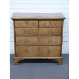 George III oak, ash and mahogany chest of two over three graduated drawers with quarter veneered top