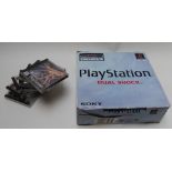 Sony PlayStation Dual Shock video games console and seven games including Madden, WWF Smackdown,