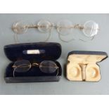 Two pairs of frameless rolled gold vintage spectacles together with a further pair of spectacles