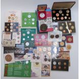 A large collection of various coin collections, some in presentation folders