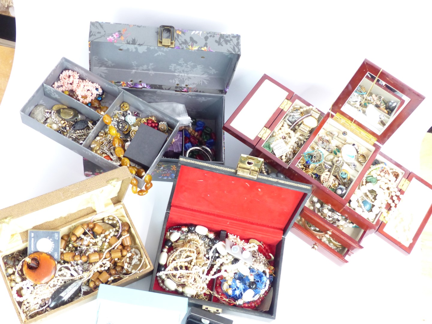 A collection of costume jewellery including beads, vintage brooches etc