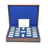 Danbury Mint, cased set of 27 hallmarked silver ingots 'Milestones of Manned Flight' minted with the