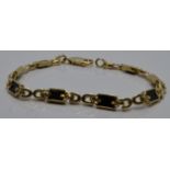 A 14k gold bracelet set with onyx