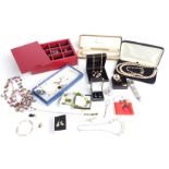 A collection of costume jewellery including beads, pearl necklace, silver bracelet set with