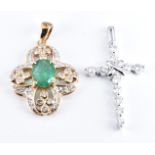 A 9ct gold pendant set with an emerald and diamonds and a 9ct white gold cross pendant set with