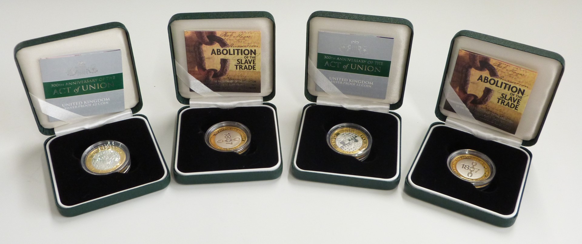 Four Royal Mint silver proof £2 coins for 2007, two Acts of Union and two slavery examples, all
