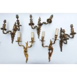 Five gilt metal Rococo style wall lights/ brackets comprising a pair and a set of three, height of