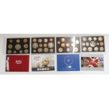 Four Royal Mint proof deluxe coin sets, 2001, 2004, 2005, and 2006, with certificates