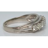 An 18ct white gold ring set with nine round cut diamonds, each approximately 0.1ct, 5.1g, size Q/R
