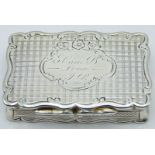George Unite Victorian hallmarked silver snuff box of shaped form with engine turned decoration,