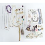 A collection of costume jewellery including vintage brooches, silver ring, rings, necklaces etc