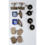 A pair of silver cufflinks set with enamel, two further pairs of silver cufflinks and buttons