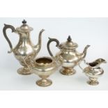 Garrard Victorian hallmarked silver four piece teaset of pedestal design with engraved decoration,