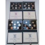 Royal Mint UK proof coin collections in deluxe cases with certificates, 1983-1986