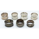 Seven various Victorian and later hallmarked silver napkin rings, weight 129g