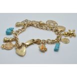 A 9ct gold charm bracelet with fourteen 9ct gold charm, 28.8g