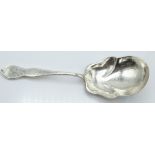 A Stowell and Son American Sterling silver hammered Arts & Crafts or Art Nouveau style serving spoon