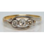An 18ct gold ring set with three diamonds in platinum setting, 2.2g, size J