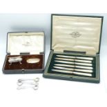A set of six hallmarked silver and mother-of-pearl fruit knives, a cased salt and three spoons,