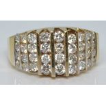 A 14k gold ring set with nine rows of diamonds in a tiered setting, 6.0g, size M/N