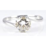 A platinum ring set with a round cut diamond of approximately 1.65ct in a twist setting, 5.1g,