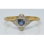 An 18ct gold ring set with a sapphire and diamonds in a platinum setting, 2.3g, size Q