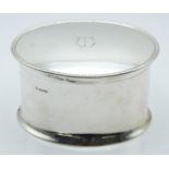 George V hallmarked silver oval biscuit barrel or similar box, with hinged lid and of waisted