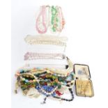 A collection of beaded necklaces including crystal, rose quartz, pearls, vintage box etc