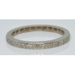 A platinum eternity ring set with diamonds, 2.4g, size M