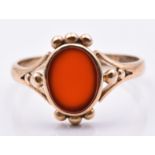 A 9ct gold ring set with carnelian agate, 1.9g, size L