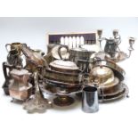 A very large collection of plated jugs, deck bell, pedestal tazza, mahogany cased fish service etc