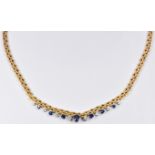Gubelin 18ct gold necklace set with an oval cut sapphire of approximately 0.68ct, six round cut