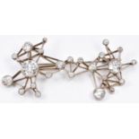 Art Deco/ mid 20thC 18ct white gold pendant/ brooch of angular framework design, set with 25