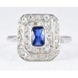Art Deco platinum ring set with an oval cut sapphire surrounded by two tiers of diamonds, 3.2g, size