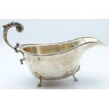 George VI hallmarked silver sauce boat raised on three feet, Birmingham 1939 maker Deakin &