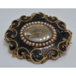 Victorian mourning brooch with a glass compartment to the centre set with hair within a border of