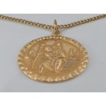 A 9ct gold St Christopher on a 9ct gold chain, 7.9g