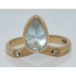 A 9ct gold ring set with a pear cut aquamarine and diamonds, 2.4g, size M