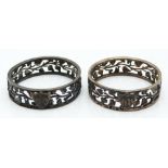 Victorian pair of hallmarked silver napkin rings with pierced foliate decoration, London 1889